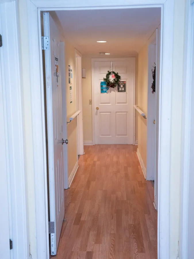 Bright hallway with hardwood floors