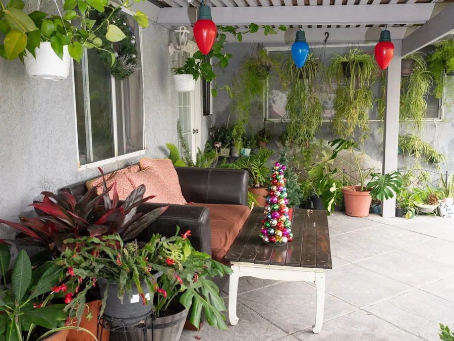 Comfortable covered patio with brown leather couch